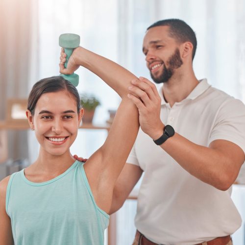 Physical therapy, smile and exercise for shoulder pain of a happy woman with a chiropractor employe.